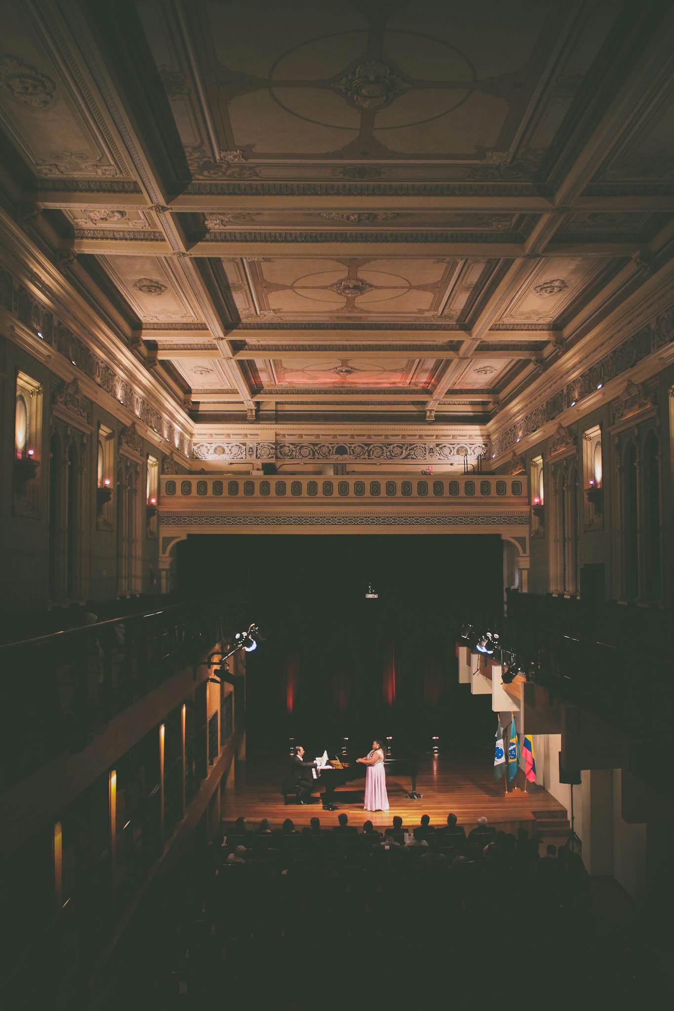 Captured in a luxurious concert hall, this elegant performance highlights stunning architecture and design.